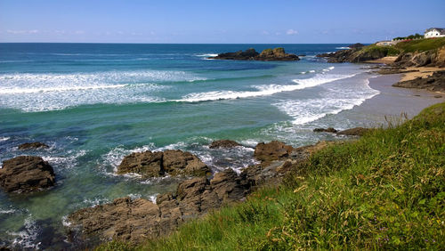 Scenic view of beach against clear sky