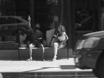 People walking on street in city