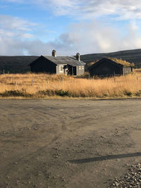 House on field against sky