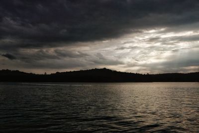 Scenic view of lake against sky during sunset