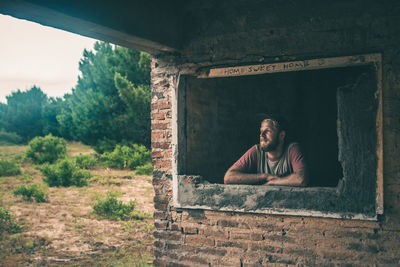 Portrait of man against built structure