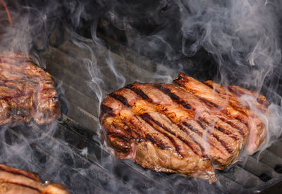 Close-up of meat on barbecue grill