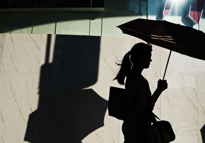 Shadow of woman on wall