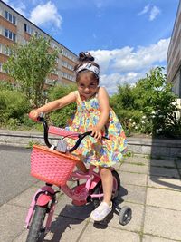 Portrait of girl riding bicycle