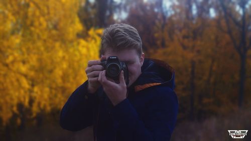 Man photographing during autumn