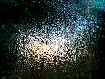 Full frame shot of wet glass window