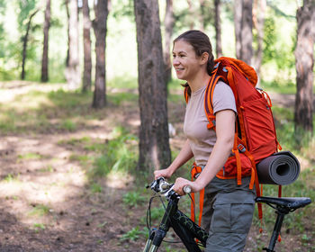Young man riding bicycle on field