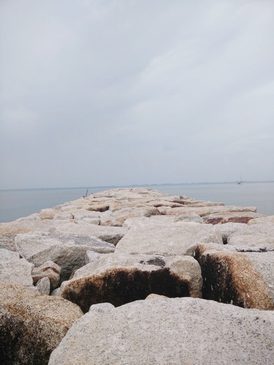 sea, horizon over water, water, beach, sky, tranquil scene, tranquility, rock - object, scenics, shore, beauty in nature, nature, cloud - sky, rock, rock formation, idyllic, coastline, stone - object, day, cloud