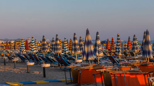 Panoramic view of boats moored in sea against clear sky