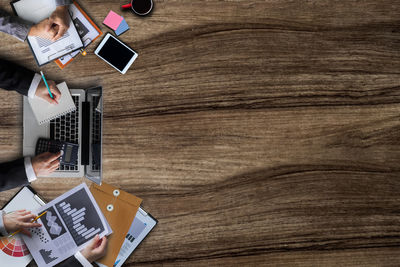 High angle view of man using laptop on table