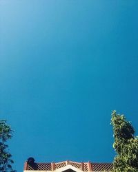 Low angle view of built structure against blue sky