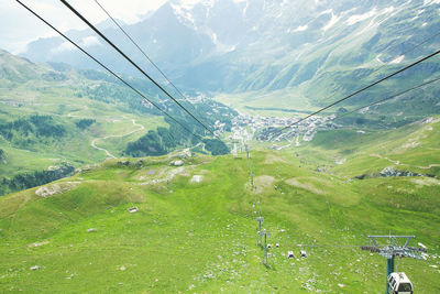 Scenic view of ski lift against sky