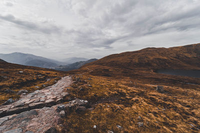 Scenic view of landscape and mountains against sky