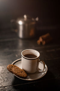 Close-up of coffee cup on table