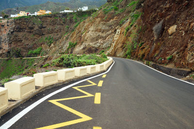 Surface level of road against clear sky