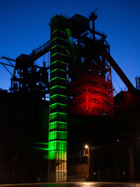 Low angle view of illuminated building at night