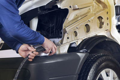 Man working in car