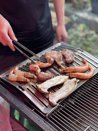 Midsection of man preparing food