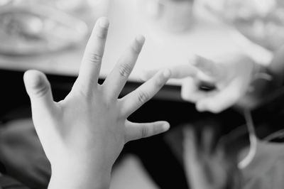 Close-up of child hand playing outdoors