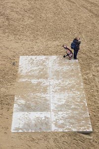 High angle view of man walking on floor