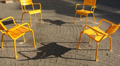 High angle view of chairs on street