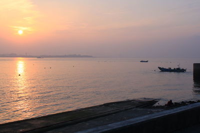 Scenic view of sea against sky during sunset