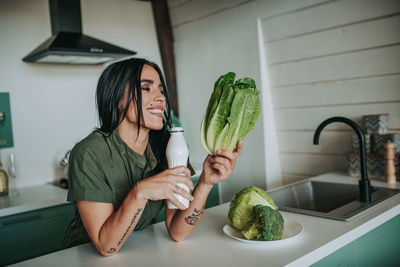 Woman holding food at home