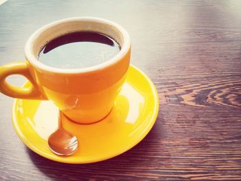 Close-up of coffee cup on table