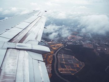 Cropped image of airplane flying over landscape