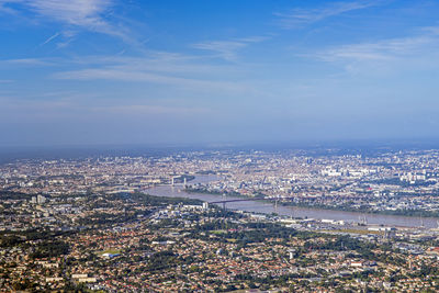 High angle view of illuminated city buildings against sky