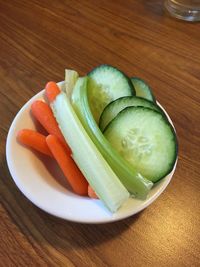 High angle view of vegetables in plate on table