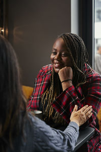 Coworkers talking during coffee break