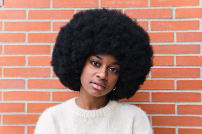 Portrait of young woman with curly hair