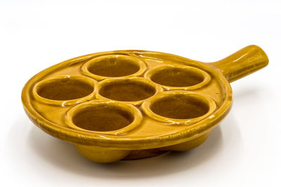 High angle view of drink on table against white background