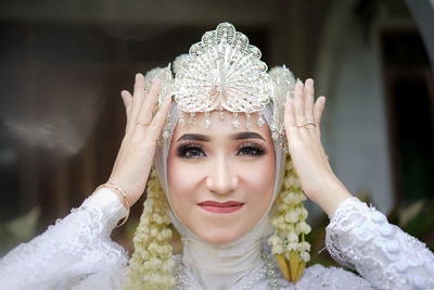 Portrait of young woman wearing wedding dress