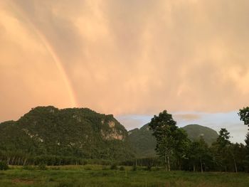 Scenic view of rainbow against sky during sunset