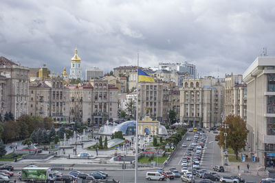 High angle view of traffic on road amidst buildings in city