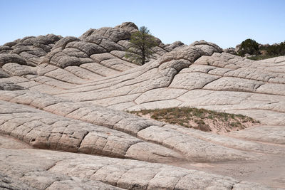 Rock formation on land against sky