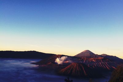 View of volcanic mountain against sky during sunset