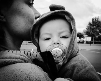 Portrait of father holding baby