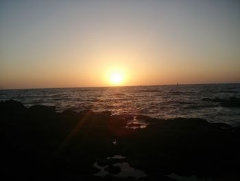 Scenic view of sea at sunset