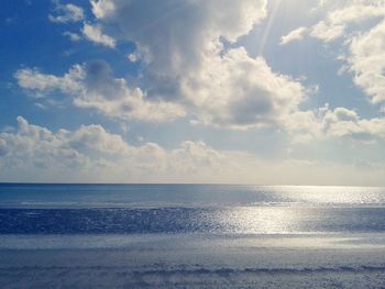 Scenic view of sea against cloudy sky