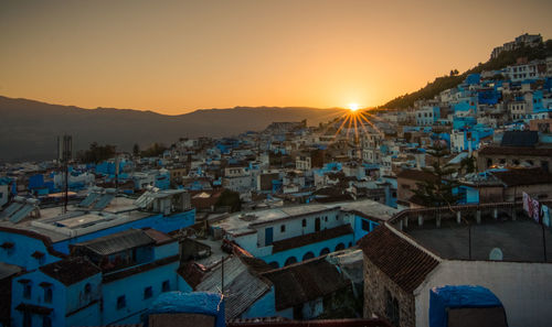 High angle view of city at sunset