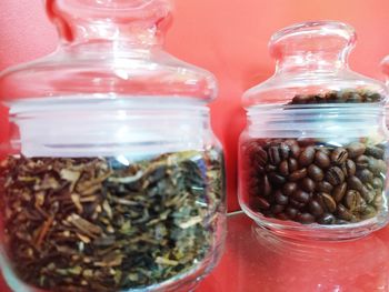 Close-up of coffee beans in glass jar on table