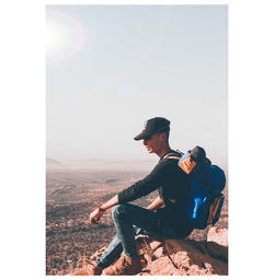 Man sitting on horse looking at view