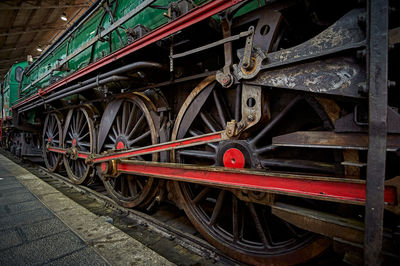 Close-up of wheels and transmission of an old locomotive