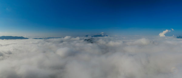 Aerial view panoramic fog and clouds over mountains at sunrise in autumn mae moh, lampang thailand.