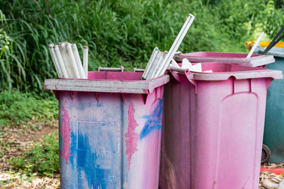 Plastic bins were left in the garbage collection area. pollute