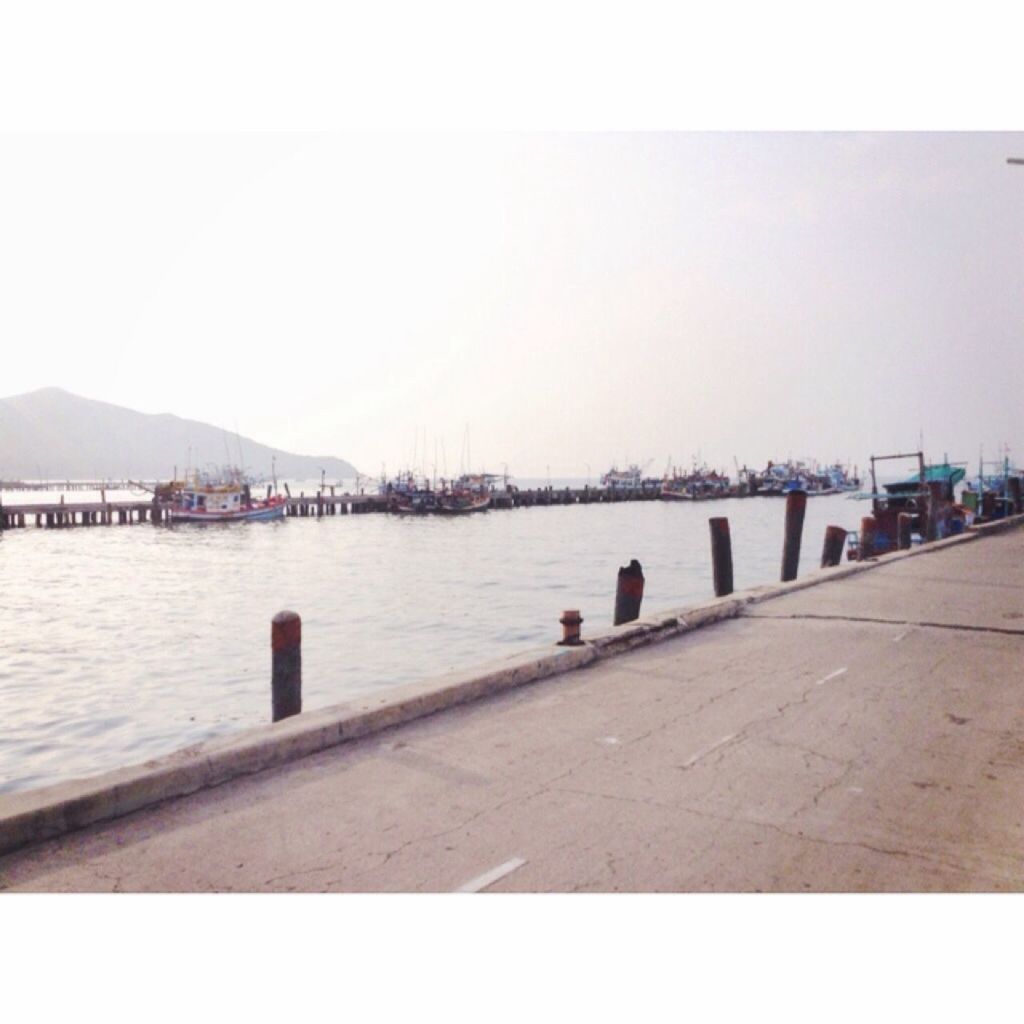 water, clear sky, copy space, built structure, railing, pier, architecture, sea, river, bridge - man made structure, connection, bridge, tranquil scene, tranquility, nature, scenics, rippled, outdoors, day, lake