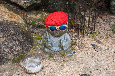 High angle view of sunglasses on stone wall